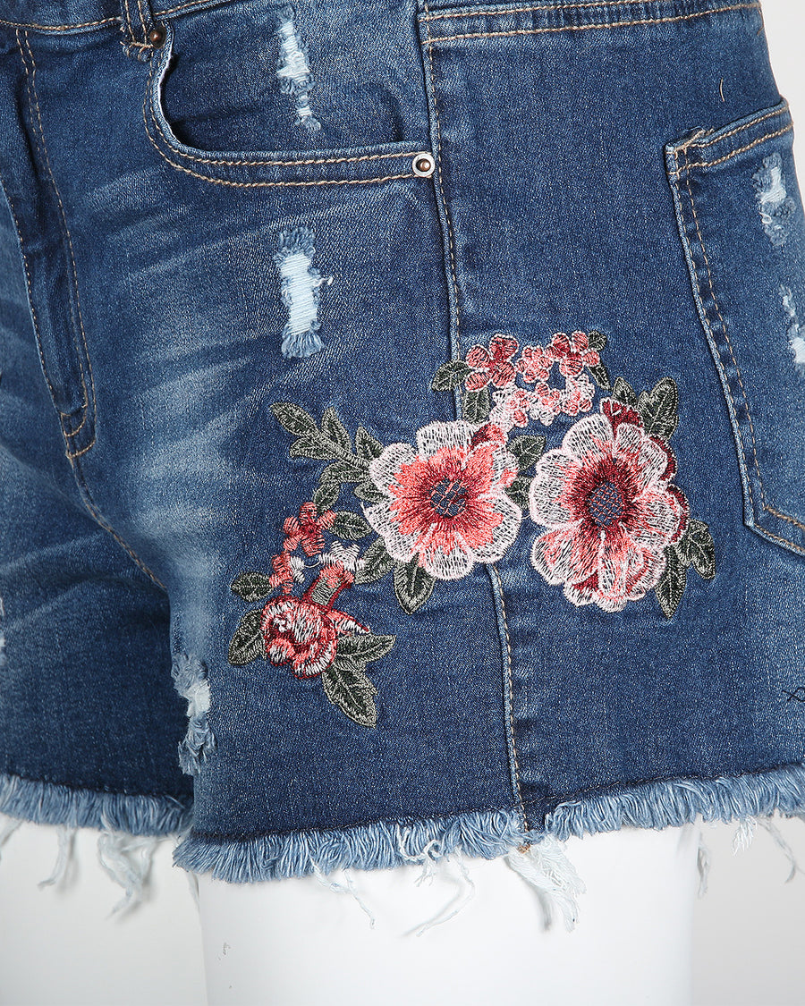 MID RISE DISTRESSED FLORAL DENIM SHORTS